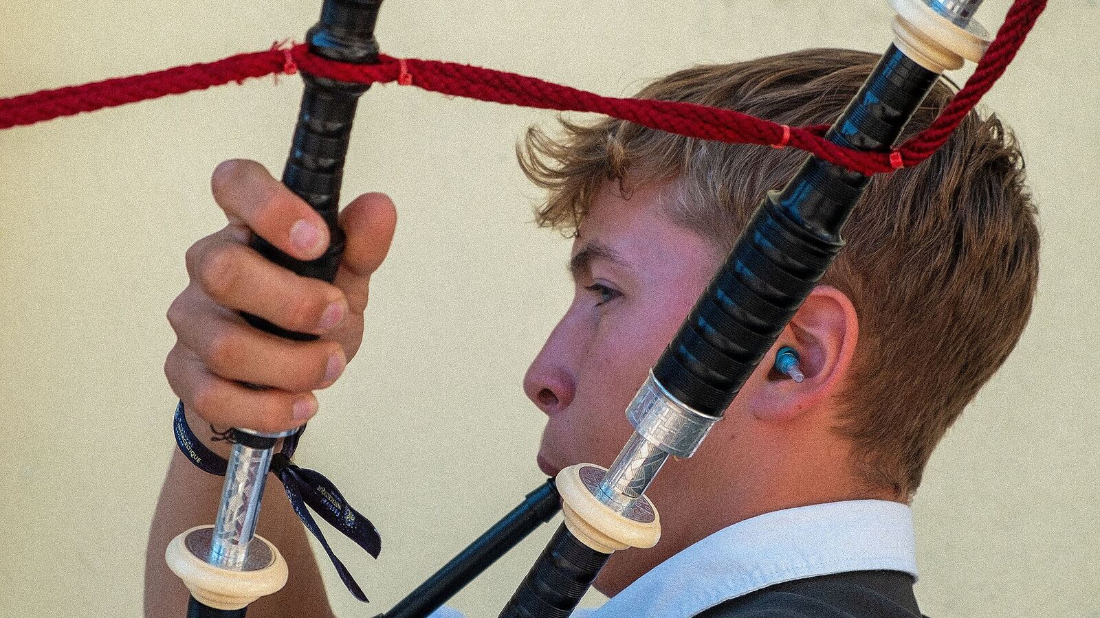 A Breton piper tuning his biniou